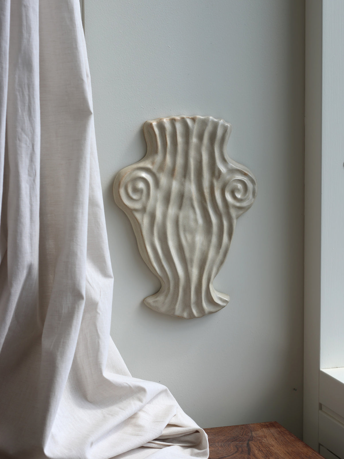 Euterpe, ceramic muse vase relief in Antique White, sculptural wall piece by Laoru Laoru